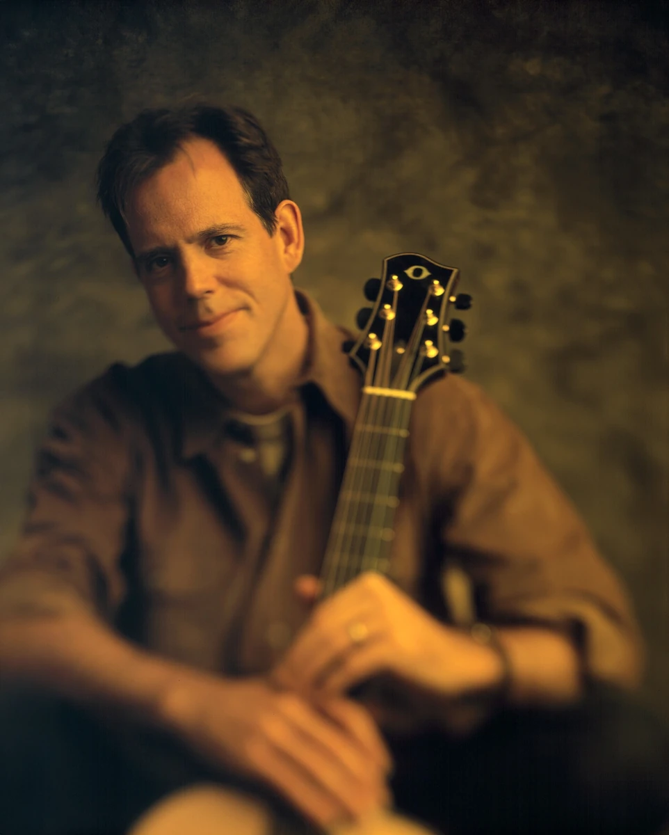 Man holding a guitar